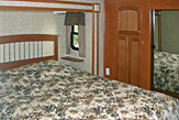 Bedroom in the Dogwood Acres fifth wheel rental trailer.