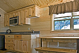 Kitchen and dining area of the Dogwood Acres full-service camping cabin.