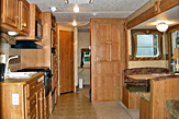 Kitchen and dining area of the Dogwood Acres rental trailer.